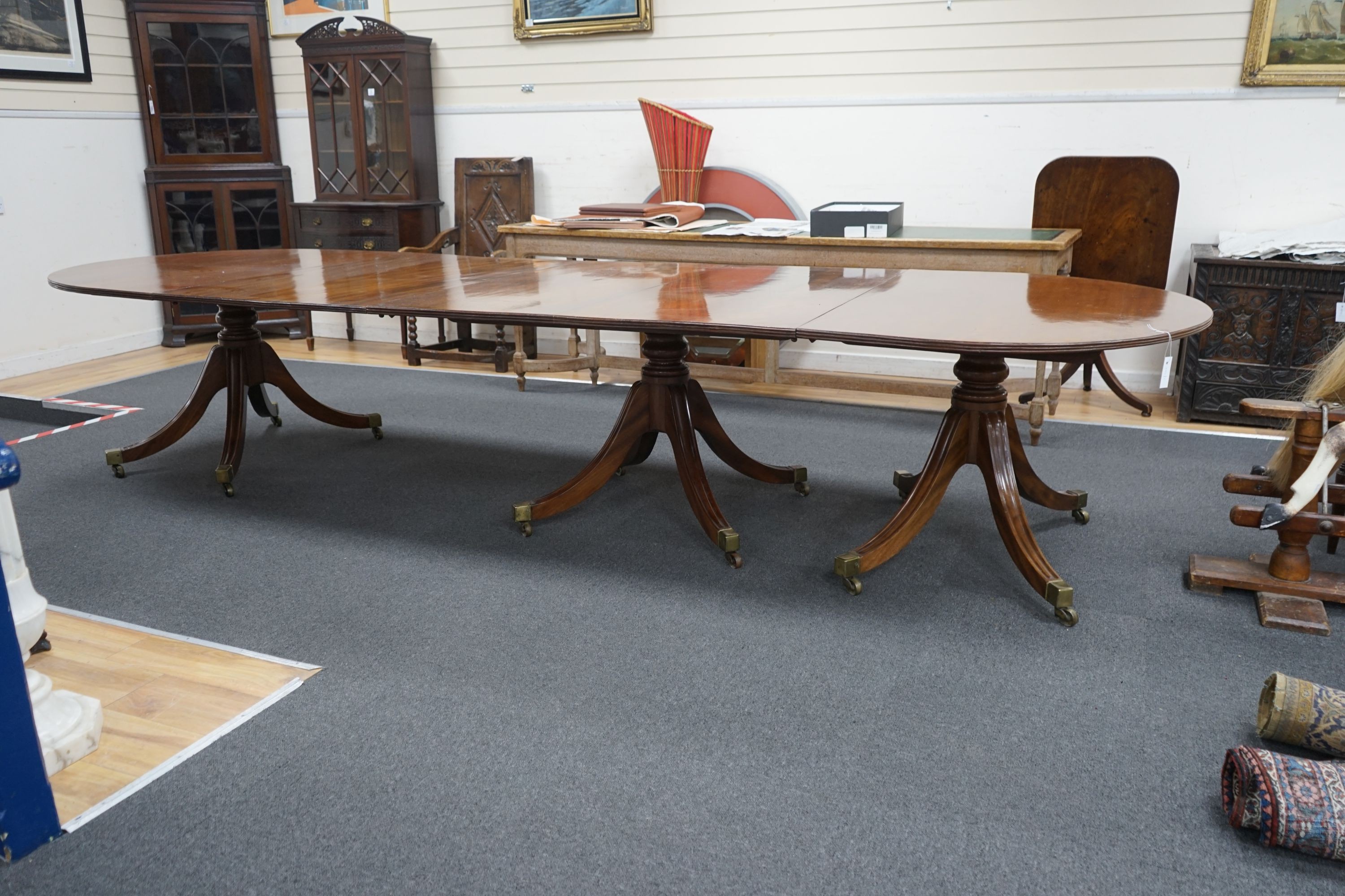 A George III and later mahogany three pillar D end extending dining table, one spare leaf, 376cm extended, width 128cm, height 72cm